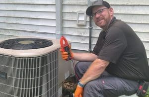 Climate Plus Technician With Air Conditioning System